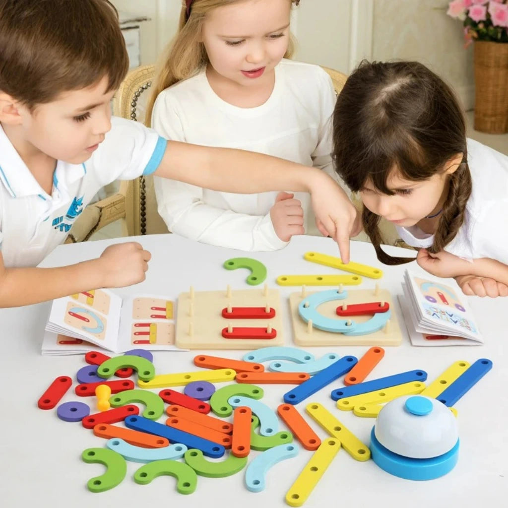 Kids playing enthusiastically with the Creative Battle Nail Board set on a white table.