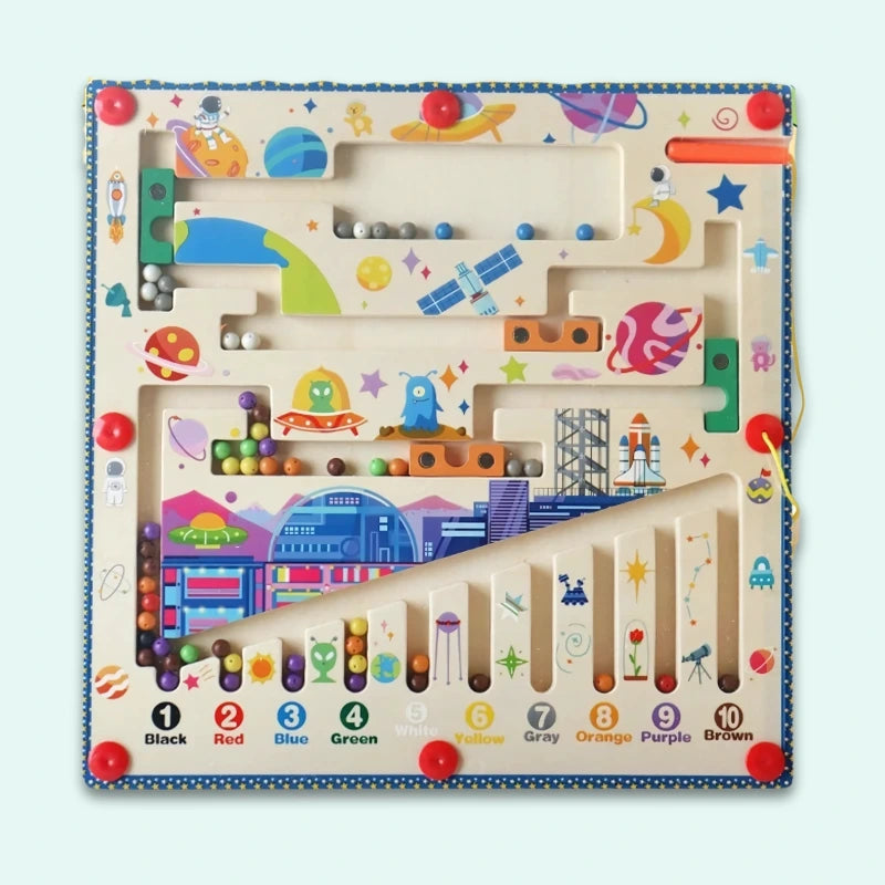 Space-themed Magnetic Color & Number Maze featuring planets, astronauts, aliens, rockets, satellites, and a space station, with ten color-coded numbered channels for educational play.